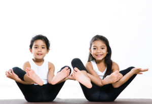 Two small girls doing Yoga