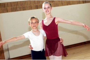 brother and sister doing ballet together