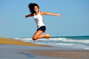 Happy girl on the beach during her periods