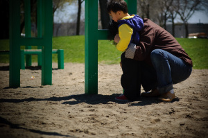 Child with parent in the park